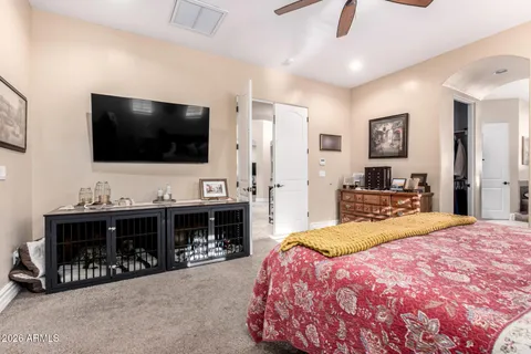 a bathroom with a granite countertop tub sink and mirror
