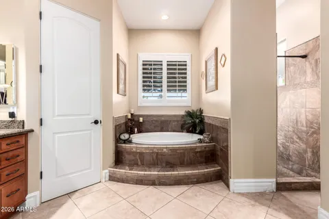 a bed room with a bed and a chandelier