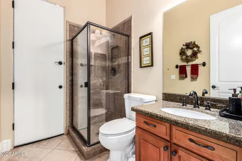 a white toilet sitting next to a bathroom sink