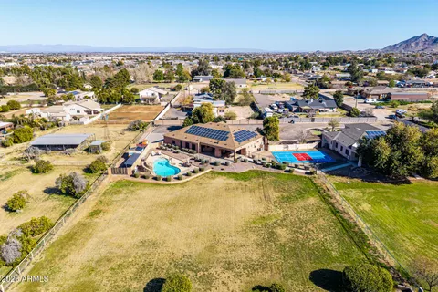 an aerial view of residential houses with outdoor space