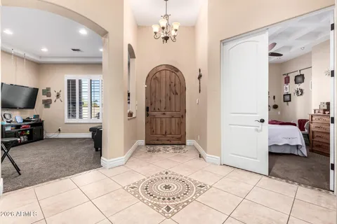 a large kitchen with a table and chairs