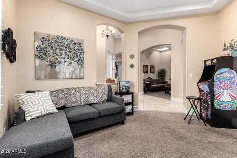 a large kitchen with stainless steel appliances a stove a sink a oven a dining table and chair