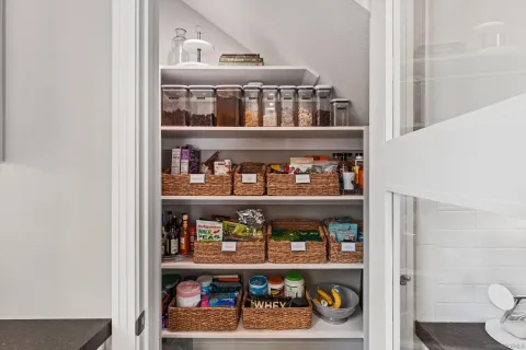 a shelf with cup and plates