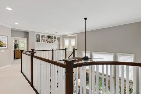 a view of a hallway with windows