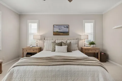 a bedroom with bed and a window