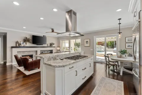 a kitchen with stainless steel appliances granite countertop a stove and a sink