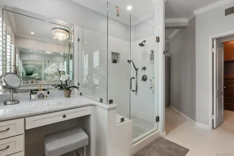 a bathroom with a double vanity sink mirror double and shower