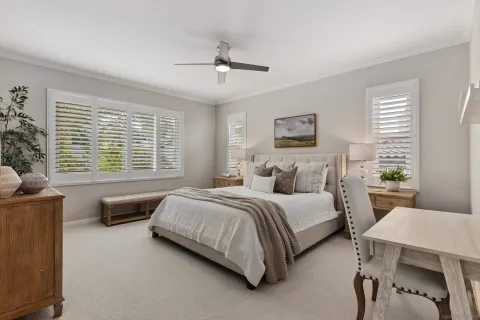 a bedroom with a bed and a couch