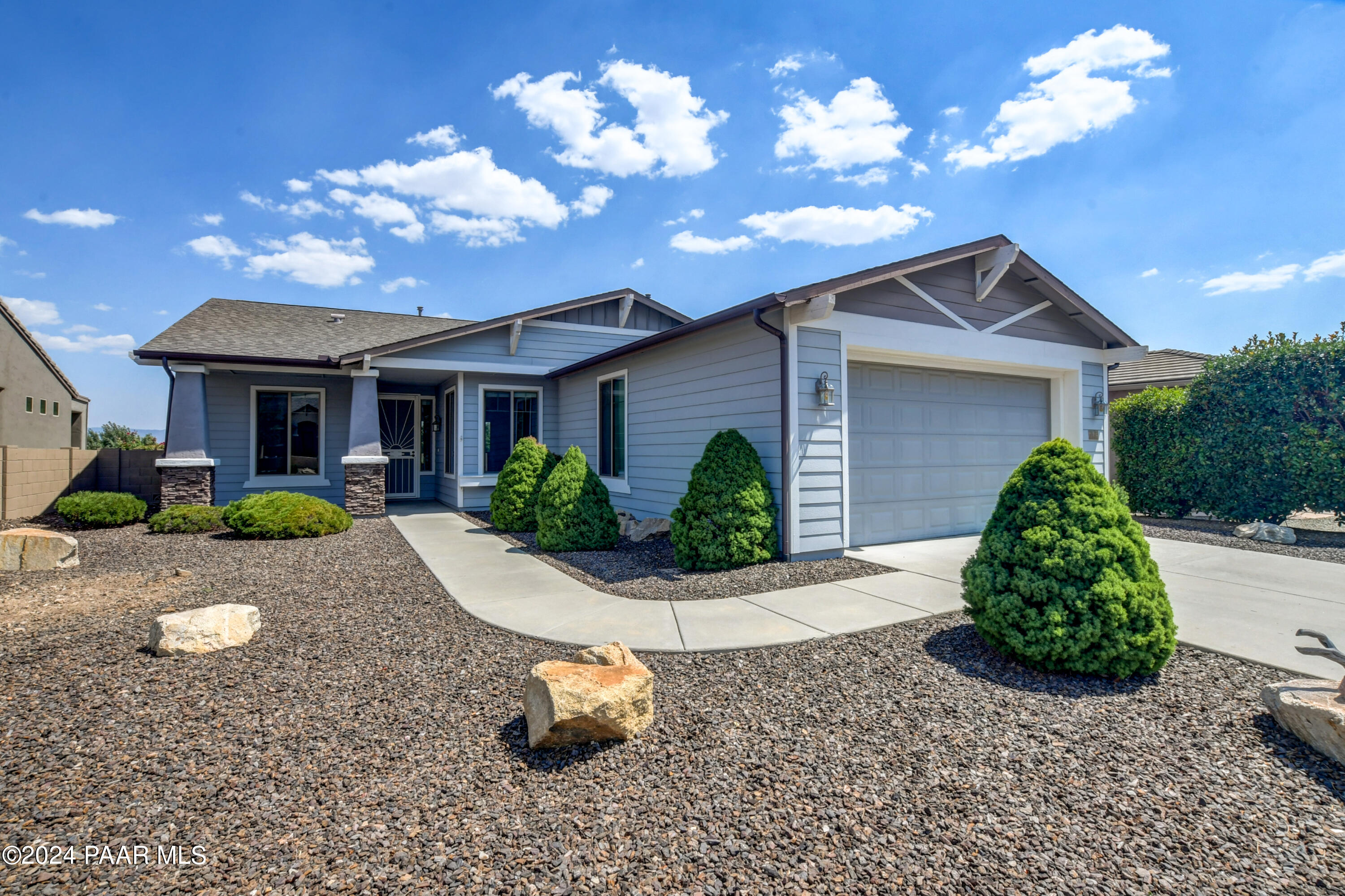 1147 Rusty Nail Road Prescott Valley, AZ 86314 - Photo 1 of 50 a front view of a house with a yard and garage