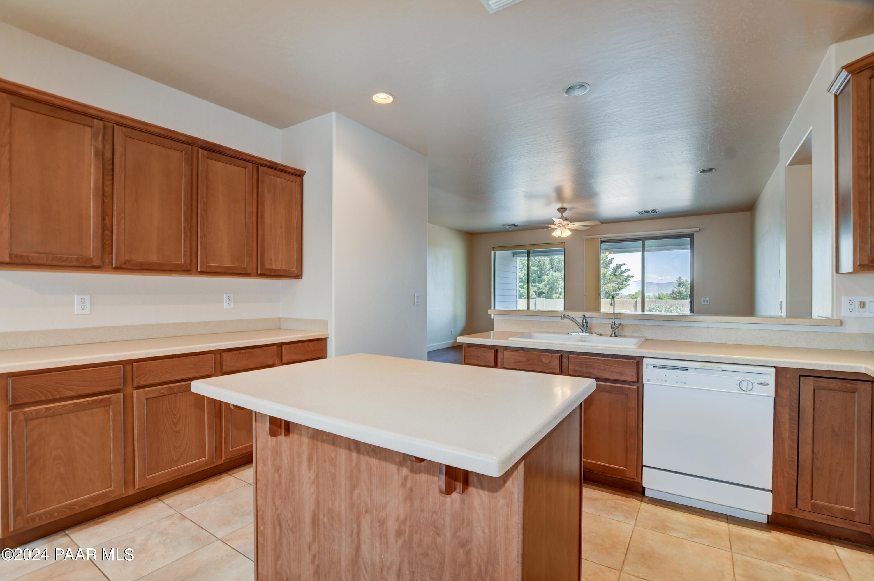 1147 Rusty Nail Road Prescott Valley, AZ 86314 - Photo 12 of 50 a kitchen with a sink and cabinets