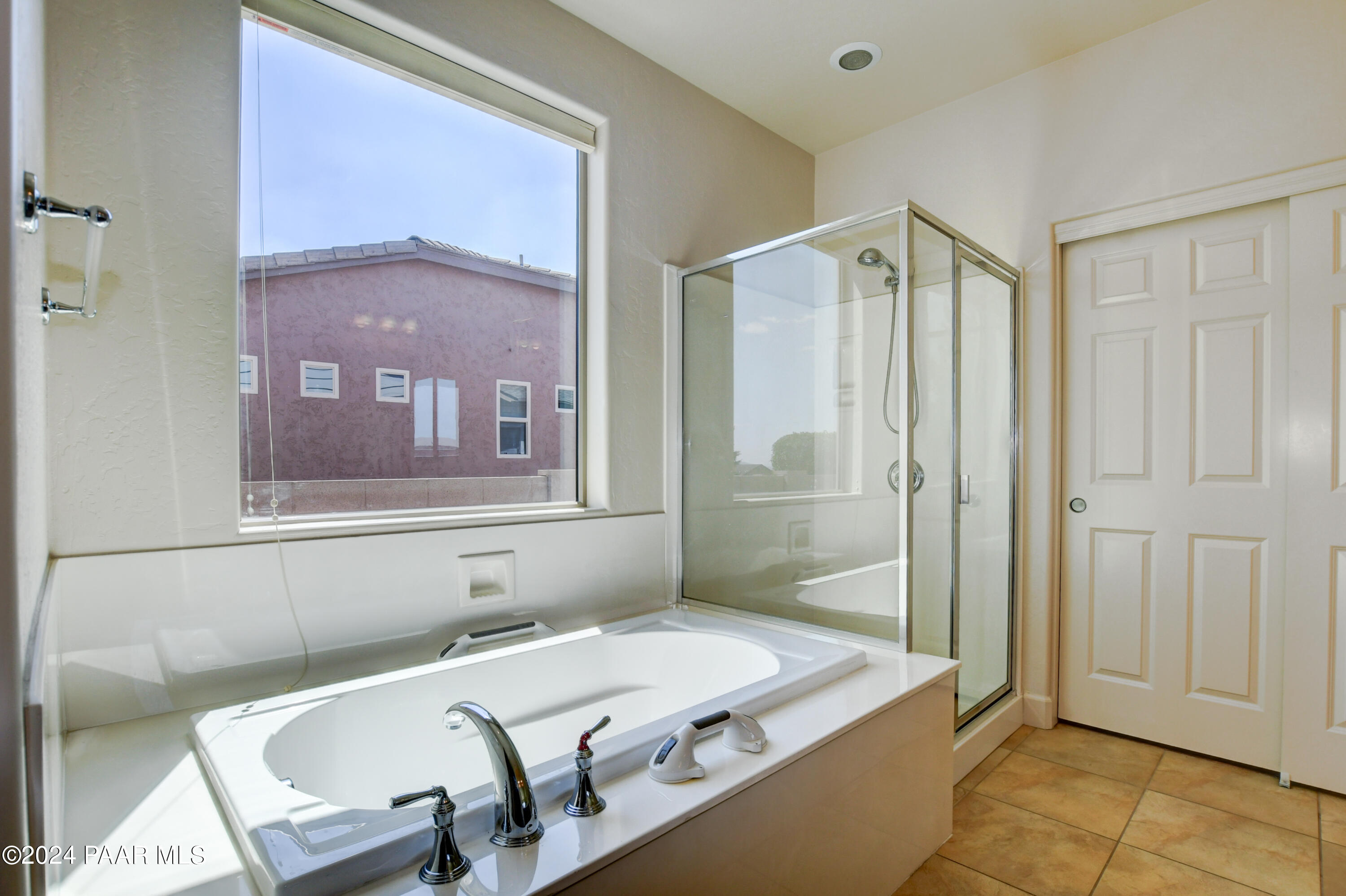 1147 Rusty Nail Road Prescott Valley, AZ 86314 - Photo 17 of 50 a bathroom with a tub and shower