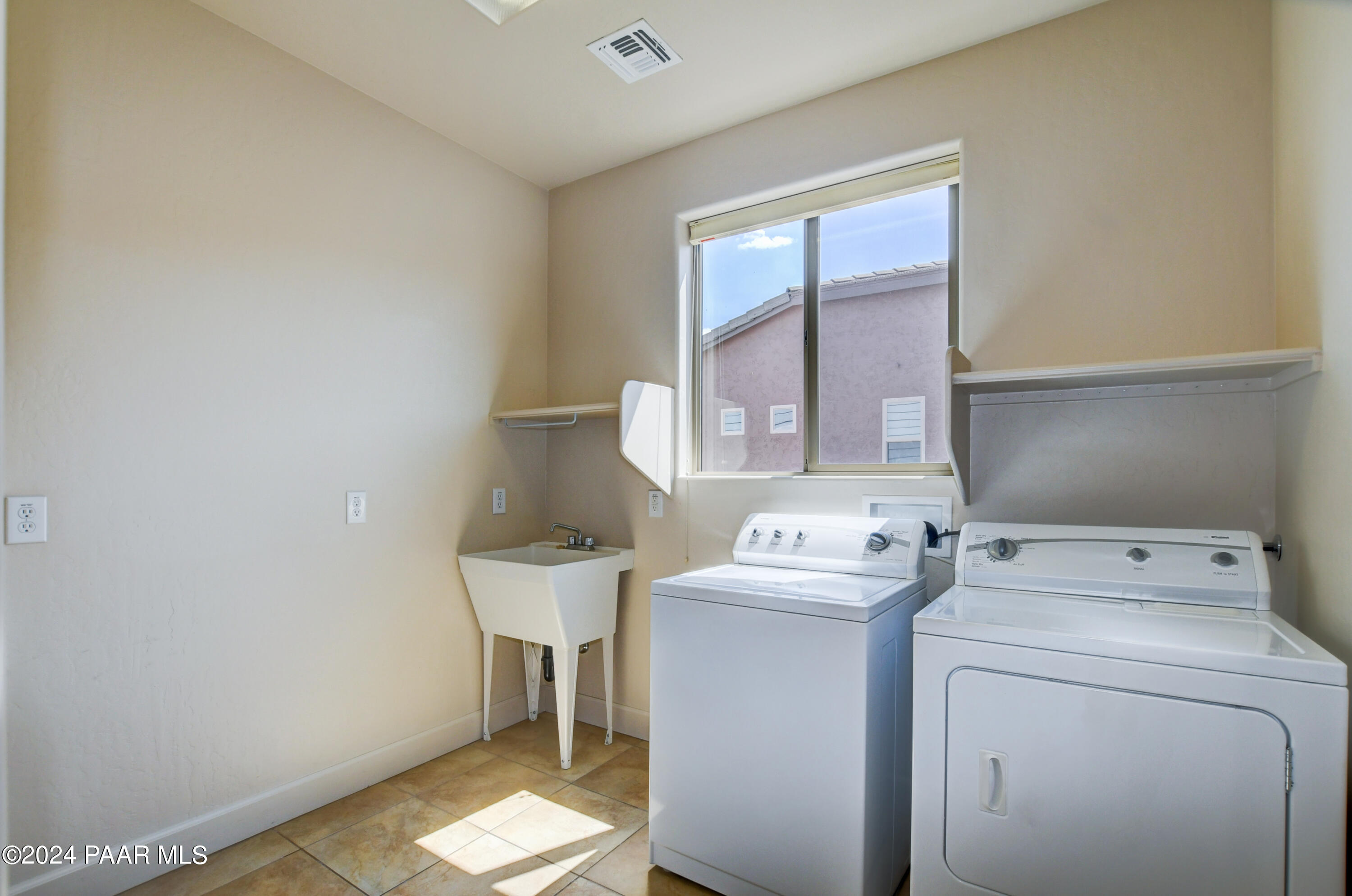 1147 Rusty Nail Road Prescott Valley, AZ 86314 - Photo 27 of 50 a utility room with dryer and washer