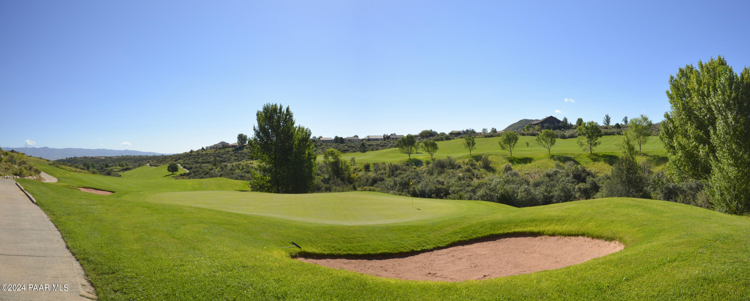 1147 Rusty Nail Road Prescott Valley, AZ 86314 - Photo 42 of 50 a view of a grassy area with an trees