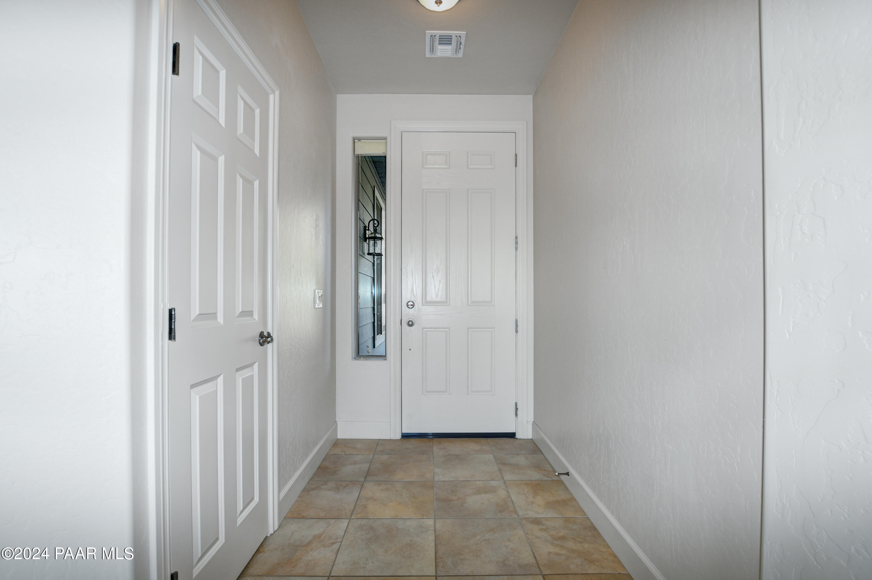 1147 Rusty Nail Road Prescott Valley, AZ 86314 - Photo 5 of 50 a view of a hallway with two rooms