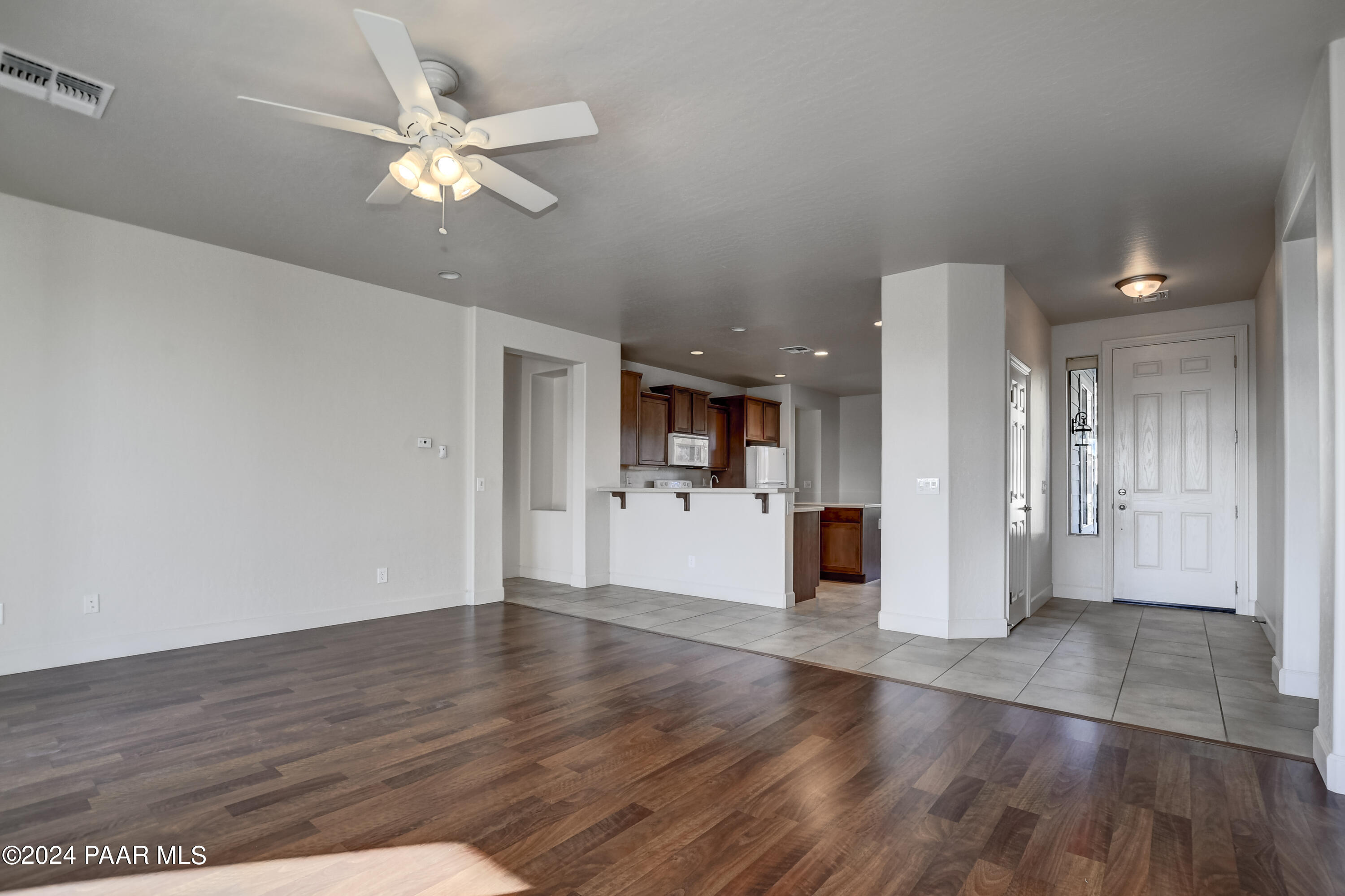 1147 Rusty Nail Road Prescott Valley, AZ 86314 - Photo 6 of 50 a view of a kitchen with wooden floor and a kitchen