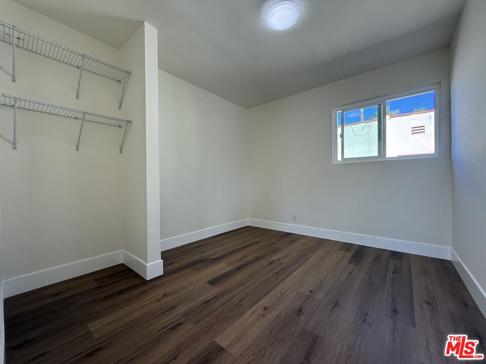 1716 Locust Avenue, Unit 5 Long Beach, CA 90813 - Photo 4 of 7 a view of an empty room with wooden floor