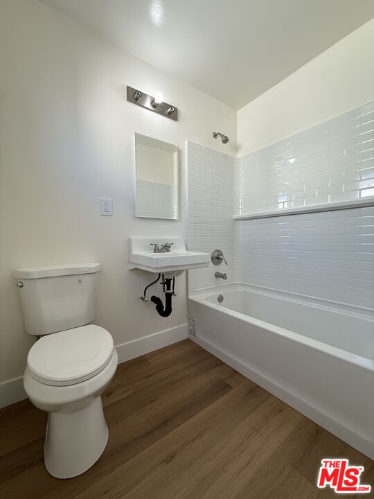 1716 Locust Avenue, Unit 5 Long Beach, CA 90813 - Photo 7 of 7 a bathroom with a toilet and a bathtub