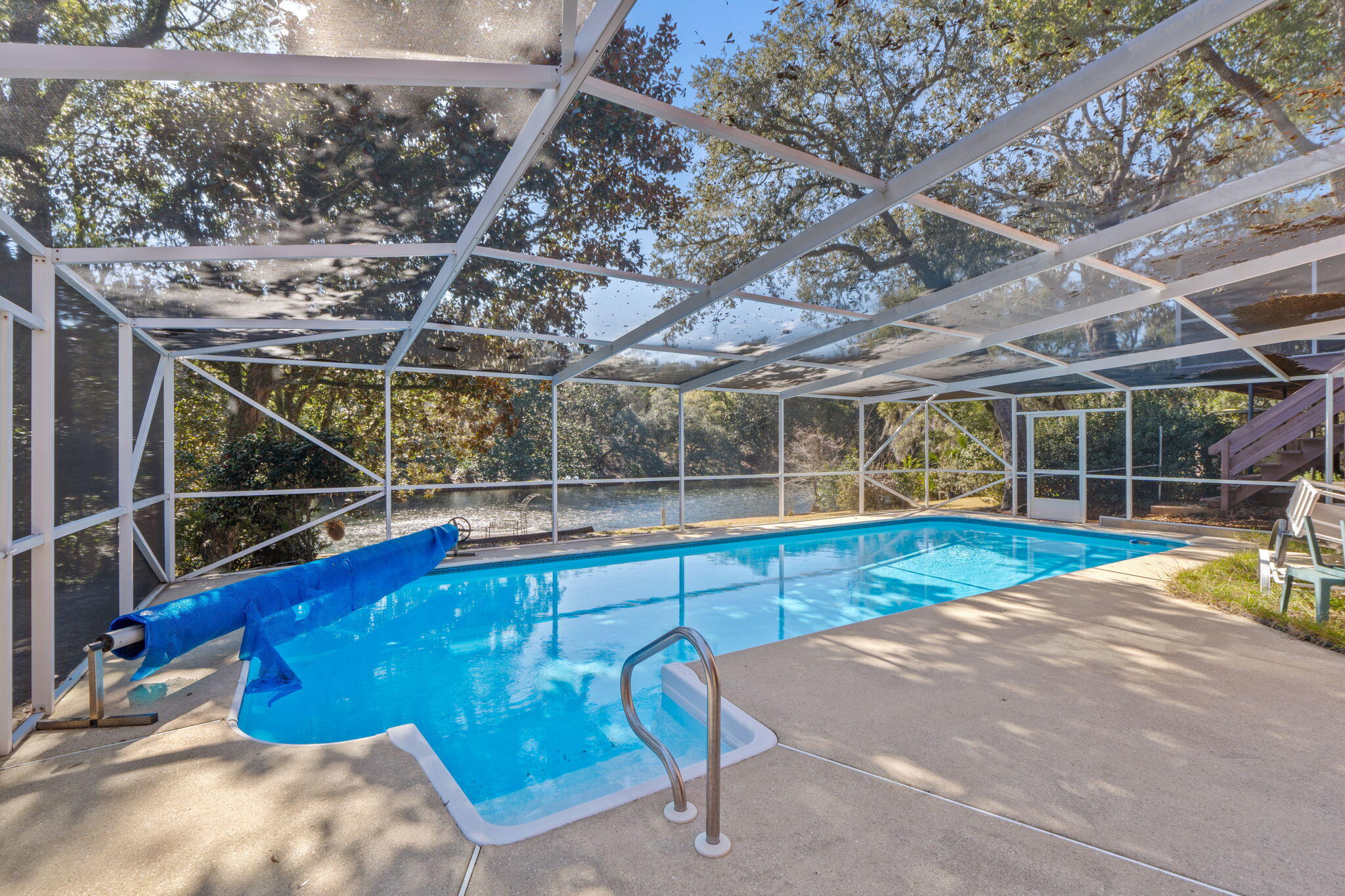20 Linwood Road Northwest Fort Walton Beach, FL 32547 - Photo 1 of 33 a view of a swimming pool with a patio and wooden fence