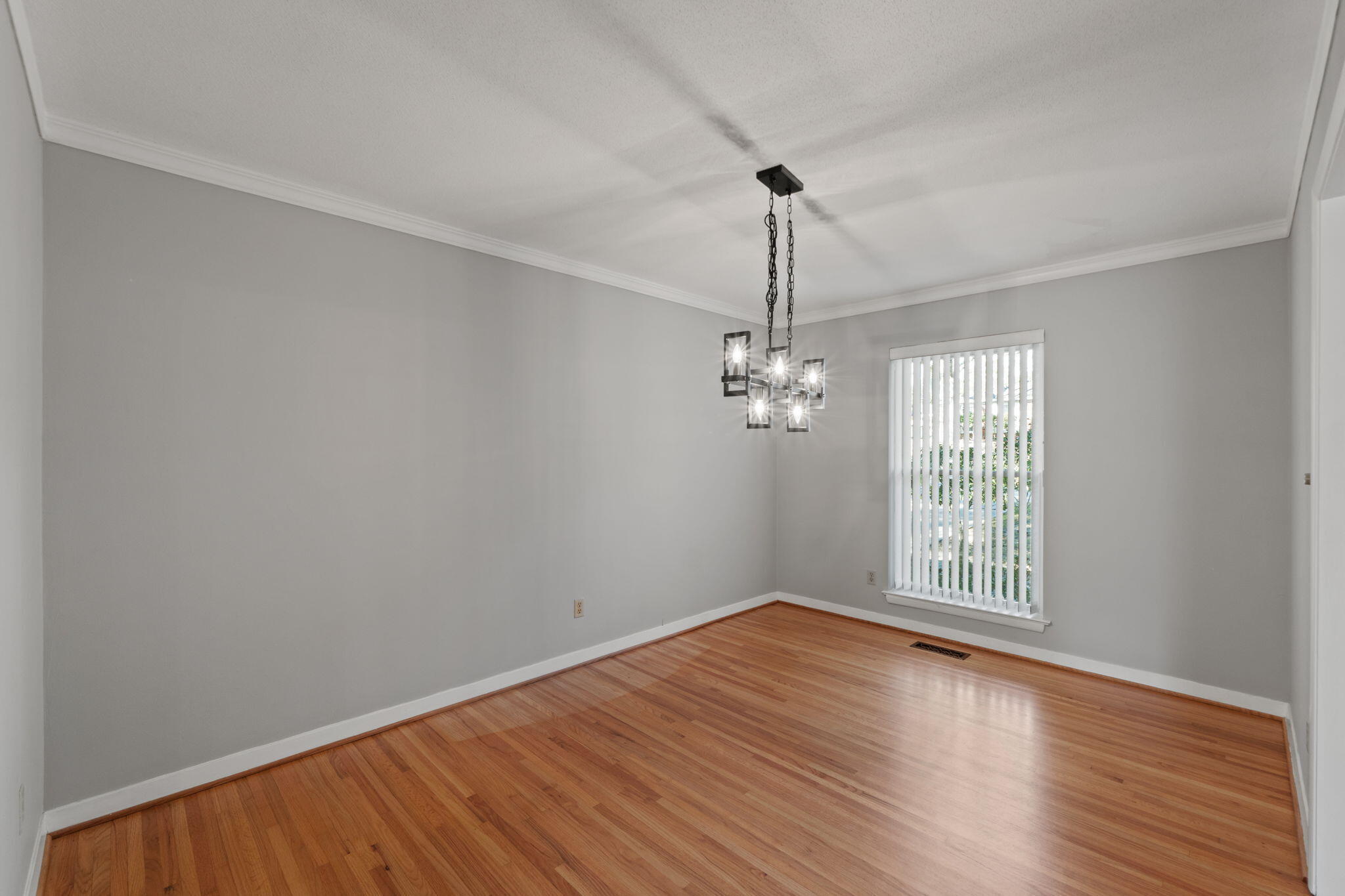 20 Linwood Road Northwest Fort Walton Beach, FL 32547 - Photo 11 of 33 a view of empty room with wooden floor fan and window