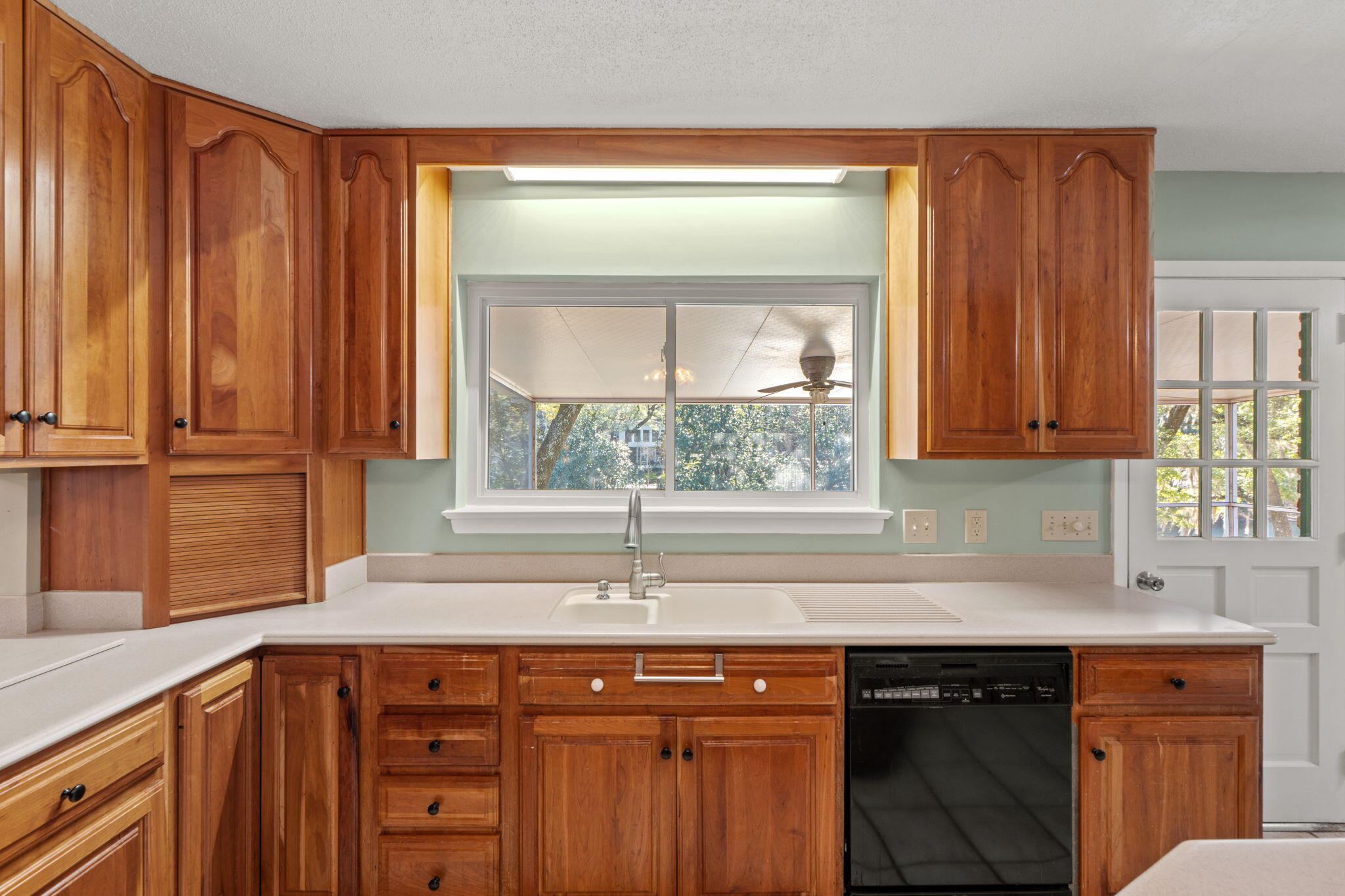 20 Linwood Road Northwest Fort Walton Beach, FL 32547 - Photo 12 of 33 a kitchen with stainless steel appliances wooden cabinets a sink and a window