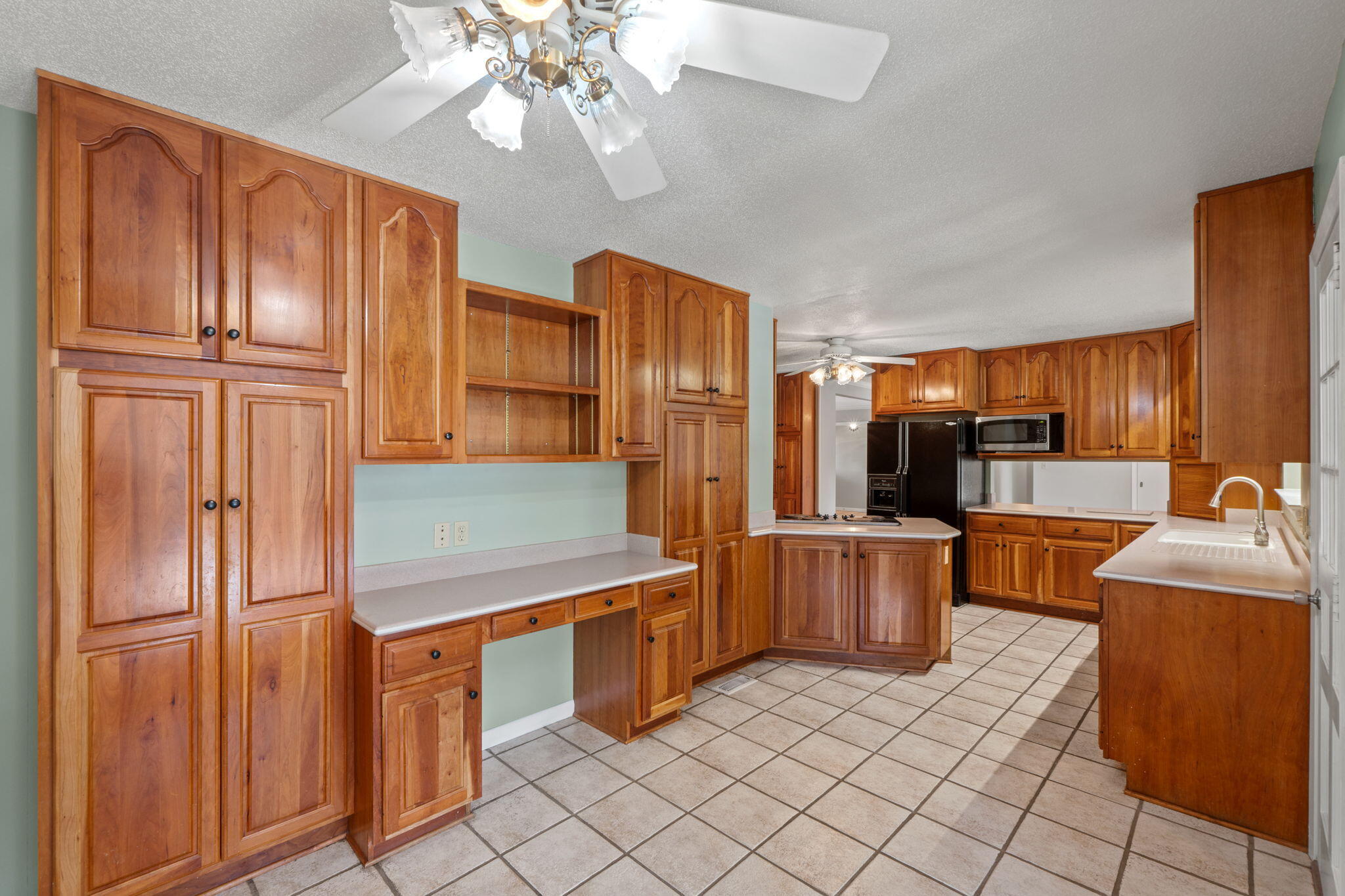 20 Linwood Road Northwest Fort Walton Beach, FL 32547 - Photo 14 of 33 a kitchen with stainless steel appliances granite countertop a refrigerator and a sink