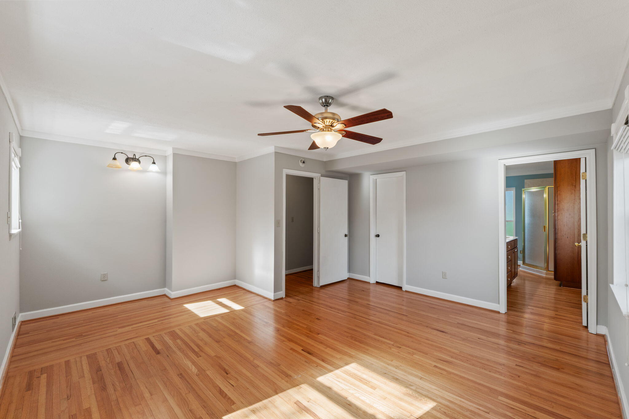 20 Linwood Road Northwest Fort Walton Beach, FL 32547 - Photo 23 of 33 a view of a livingroom with wooden floor and a ceiling fan