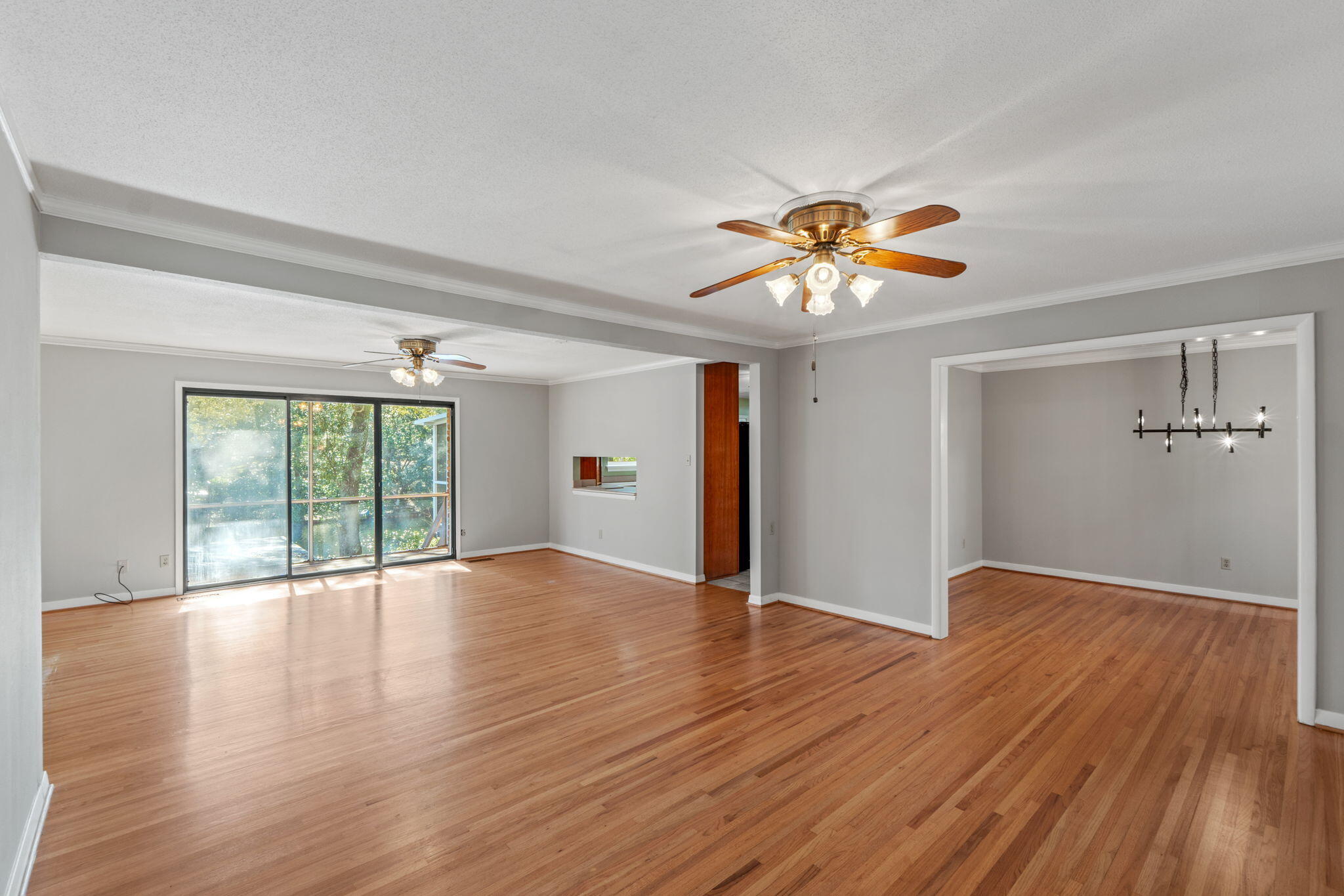 20 Linwood Road Northwest Fort Walton Beach, FL 32547 - Photo 9 of 33 a view of an empty room with a window and wooden floor