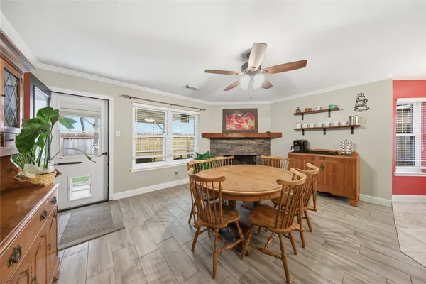 a dining room with furniture and window