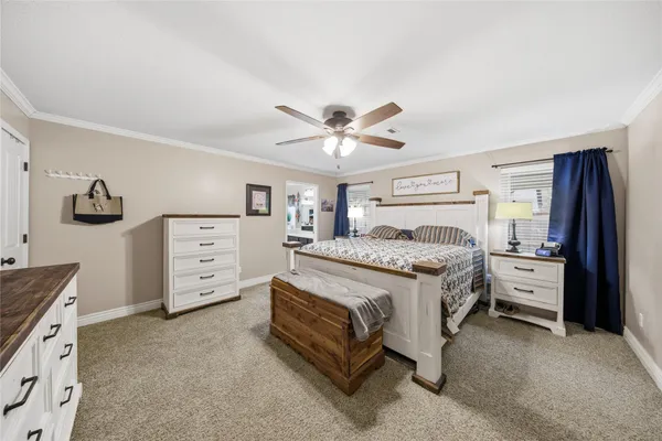 a bed room with bed and window