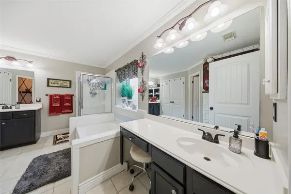 a kitchen with a sink cabinets and appliances