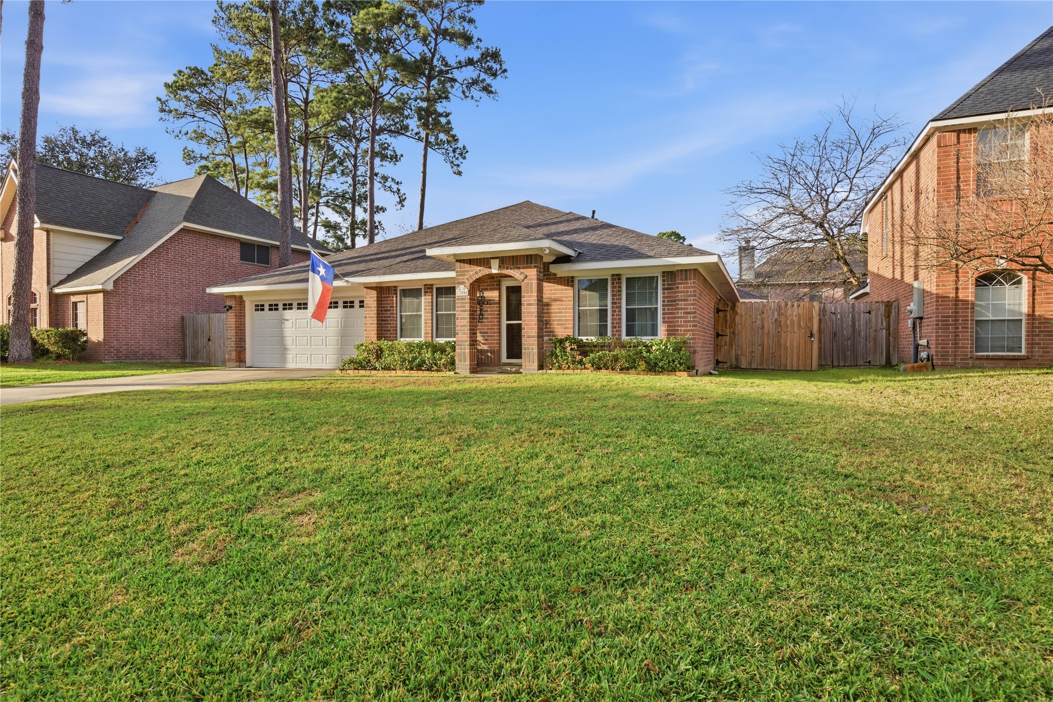 13506 Spring Court Tomball, TX 77375 - Photo 2 of 30 a front view of a house with a yard