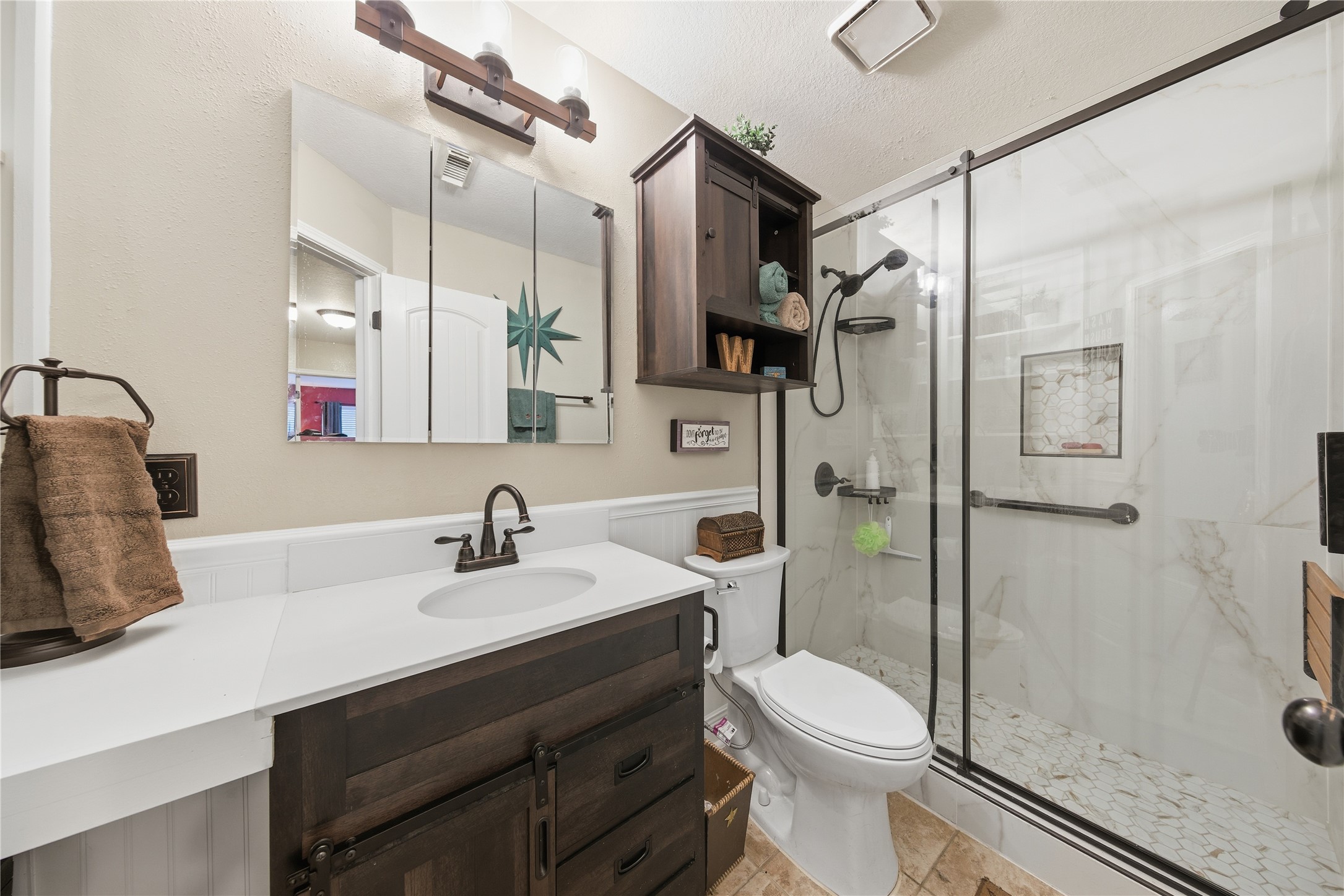 13506 Spring Court Tomball, TX 77375 - Photo 22 of 30 a bathroom with a sink toilet and shower