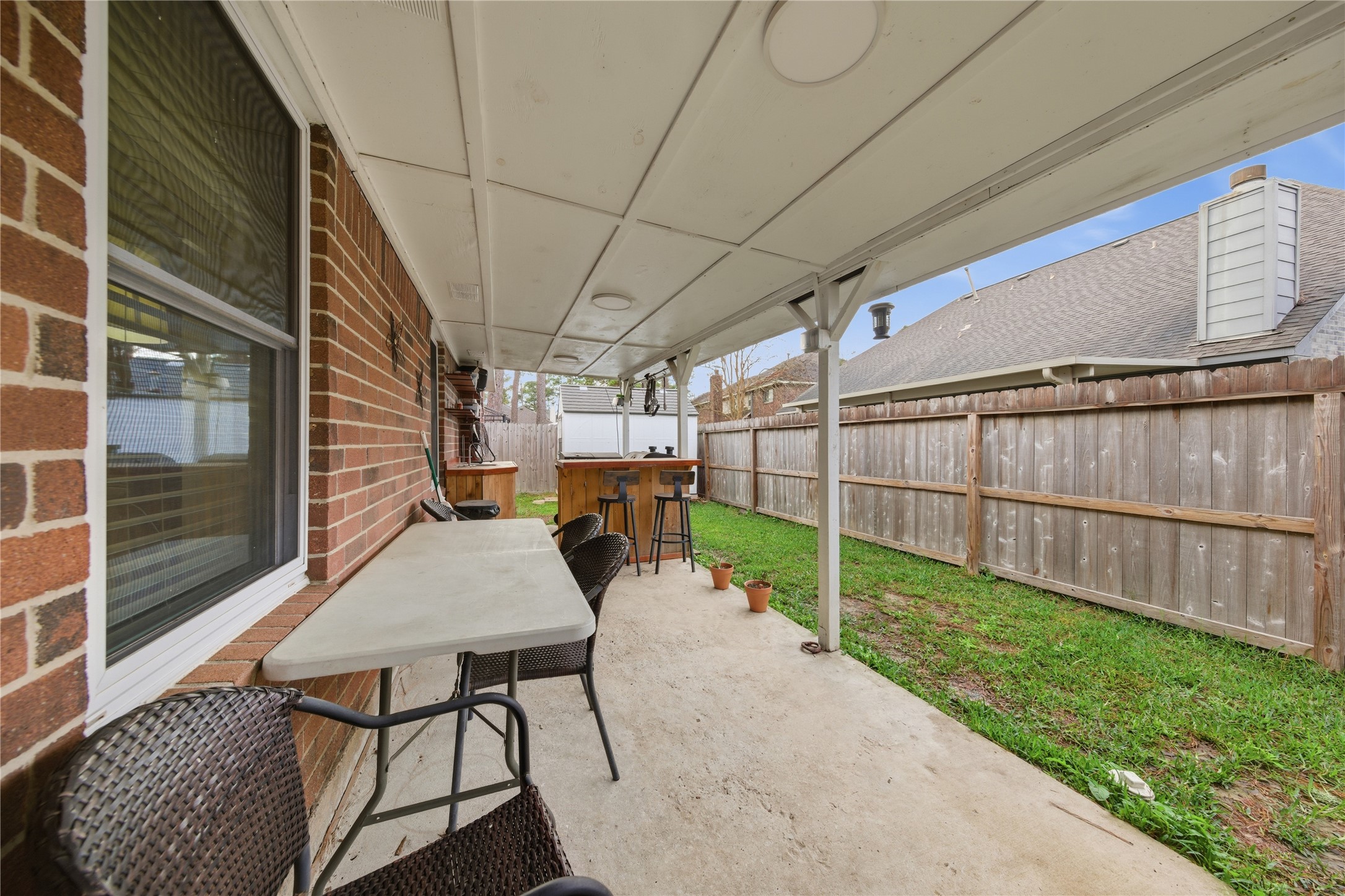 13506 Spring Court Tomball, TX 77375 - Photo 24 of 30 a backyard of a house with table and chairs
