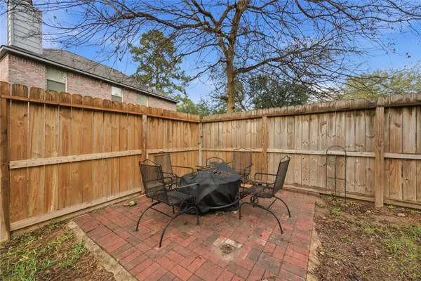 a view of backyard with outdoor seating