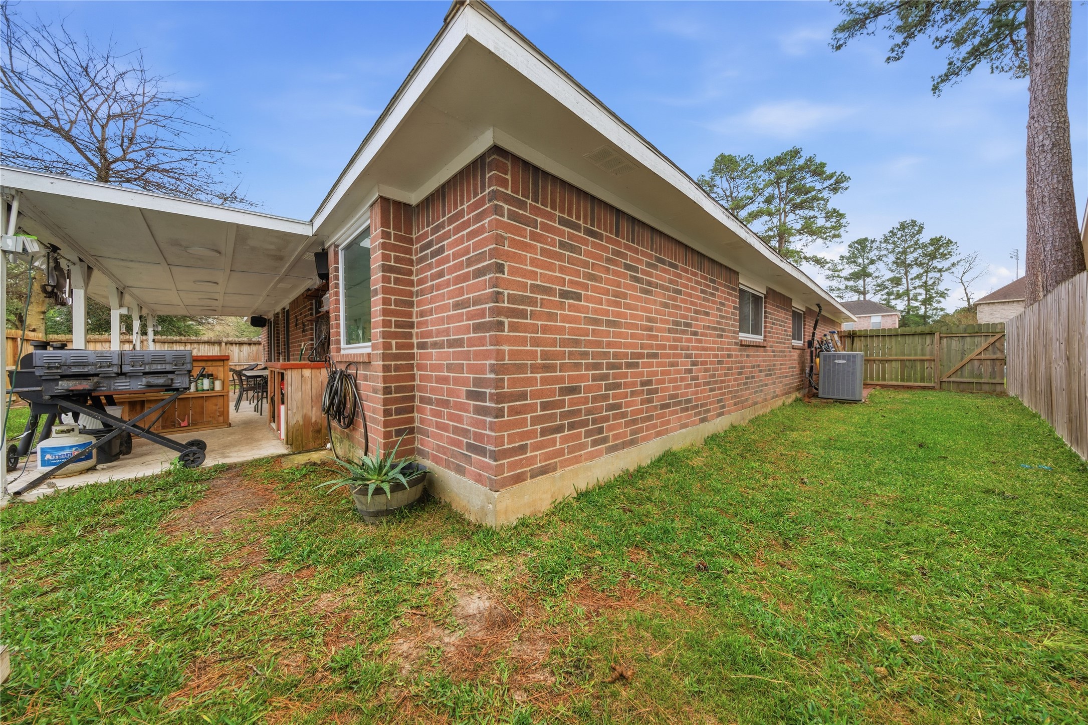 13506 Spring Court Tomball, TX 77375 - Photo 27 of 30 a view of backyard with a garden and entertaining space