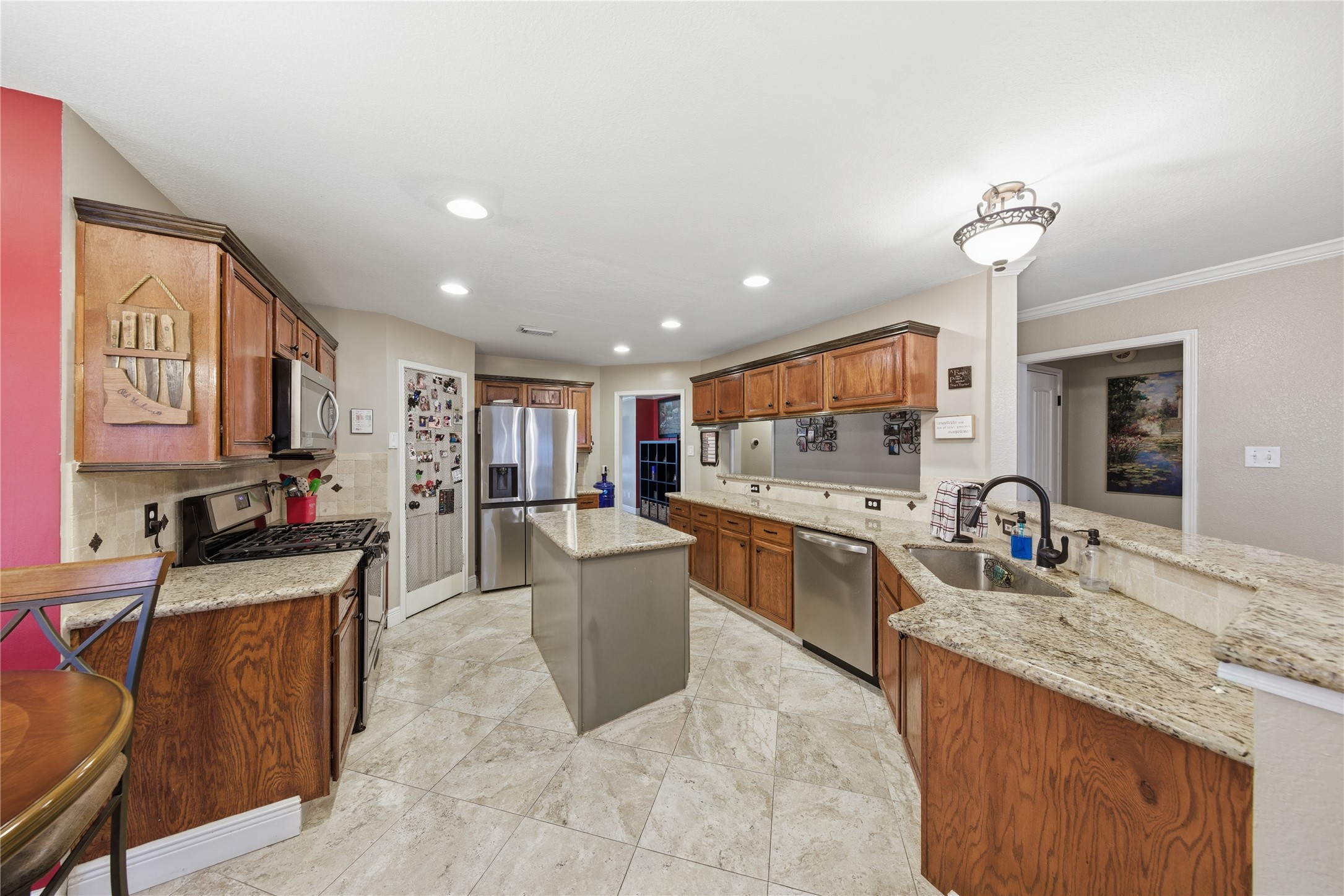 13506 Spring Court Tomball, TX 77375 - Photo 7 of 30 a kitchen with stainless steel appliances granite countertop sink stove top oven and cabinets