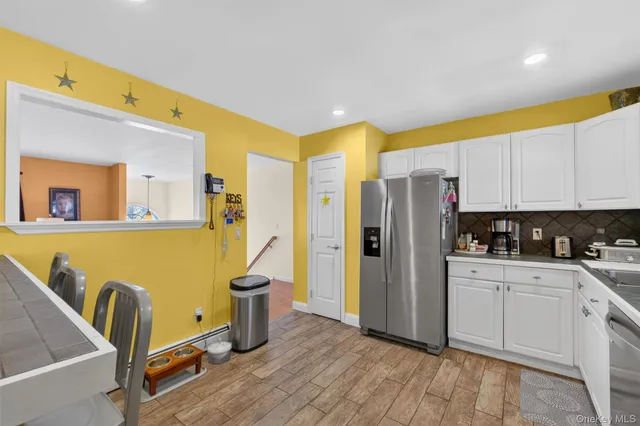 a livingroom with furniture and a flat screen tv