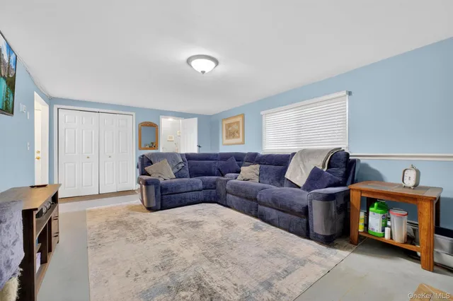 a living room with furniture a couch and a table