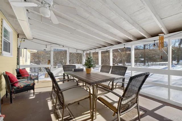 a living room with furniture and air hockey table