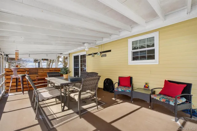 a dining room with furniture and chandelier
