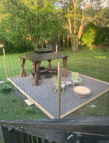 a front view of a house with a yard covered in snow
