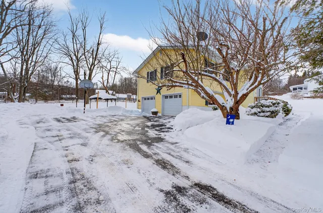 a view of a park with iron fence