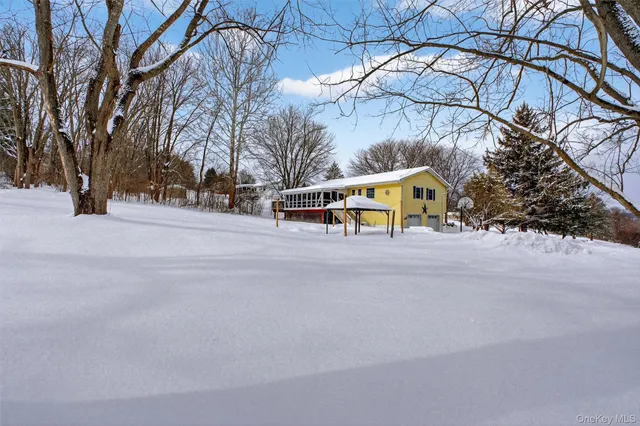 a tall buildings with trees in front of it
