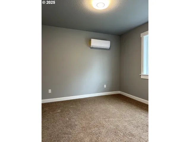 a view of entryway and kitchen