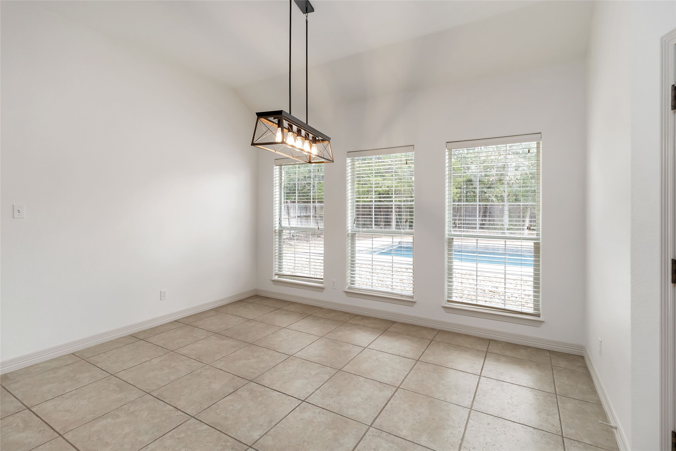 167 Winchester Road Bastrop, TX 78602 - Photo 15 of 34 Empty room featuring light tile patterned floors and baseboards