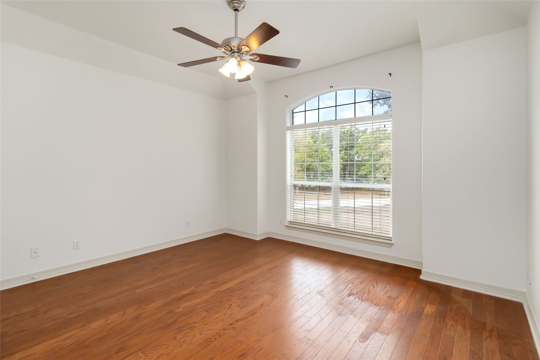 167 Winchester Road Bastrop, TX 78602 - Photo 23 of 34 Unfurnished room with wood-type flooring and a ceiling fan