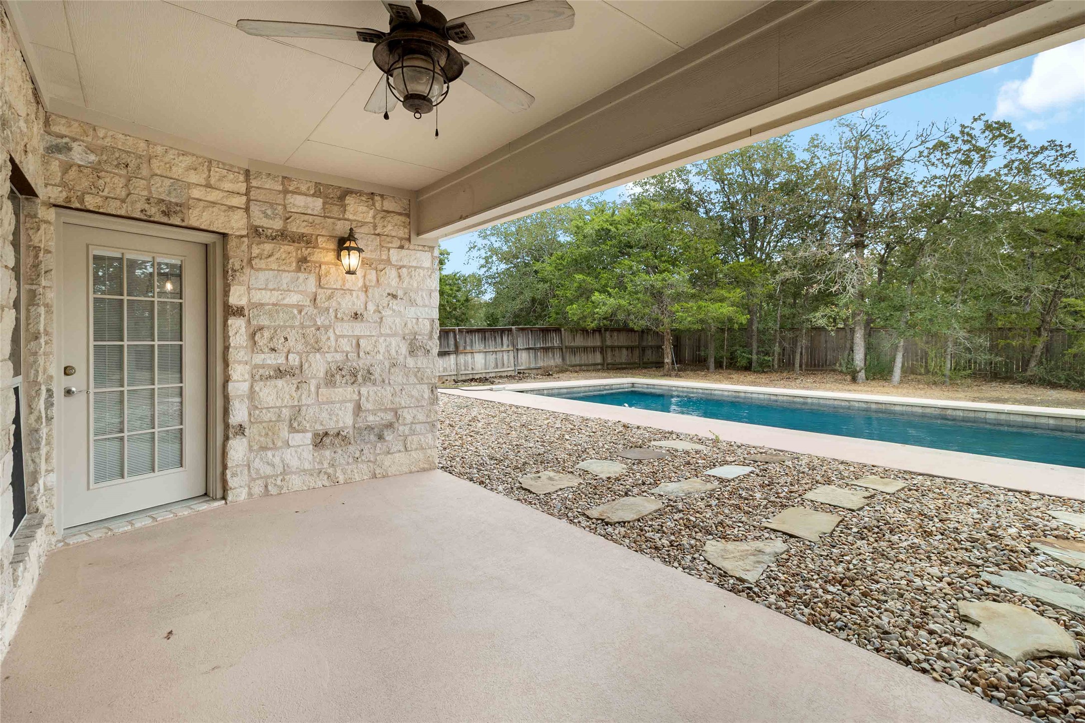 167 Winchester Road Bastrop, TX 78602 - Photo 29 of 34 View of swimming pool with a fenced backyard, a patio, and a ceiling fan