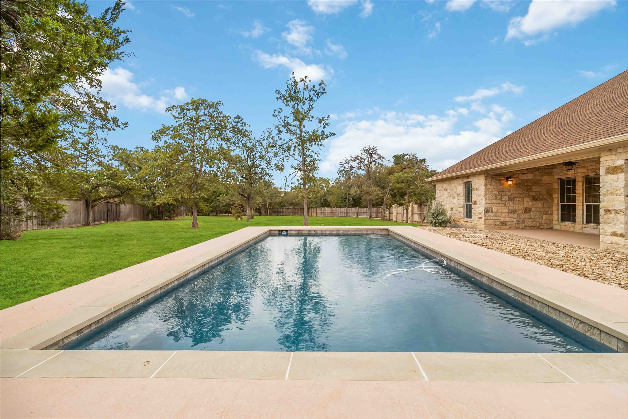 167 Winchester Road Bastrop, TX 78602 - Photo 34 of 34 View of swimming pool featuring a patio area and a fenced backyard