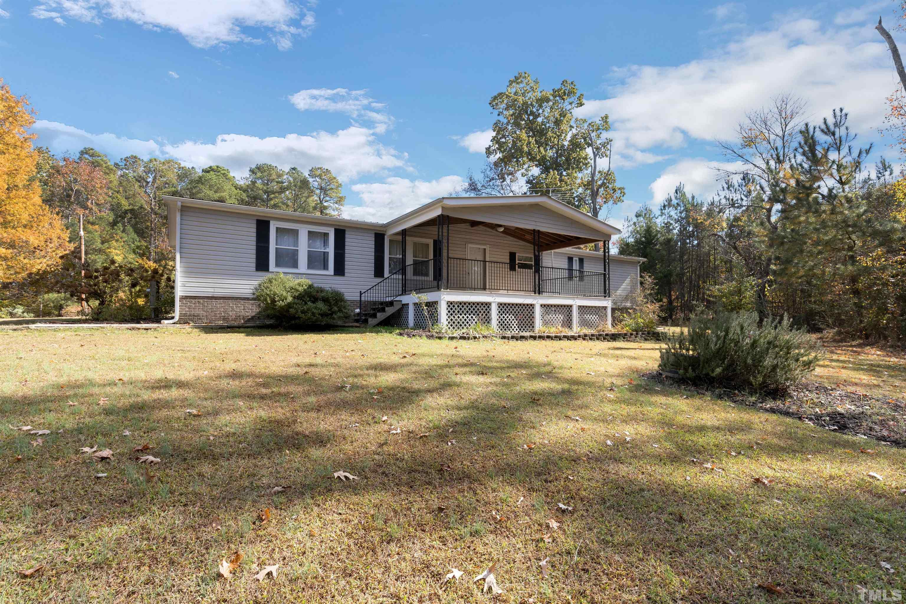 290 Thomas Cash Road Apex, NC 27523 - Photo 1 of 40 a view of a house with a yard
