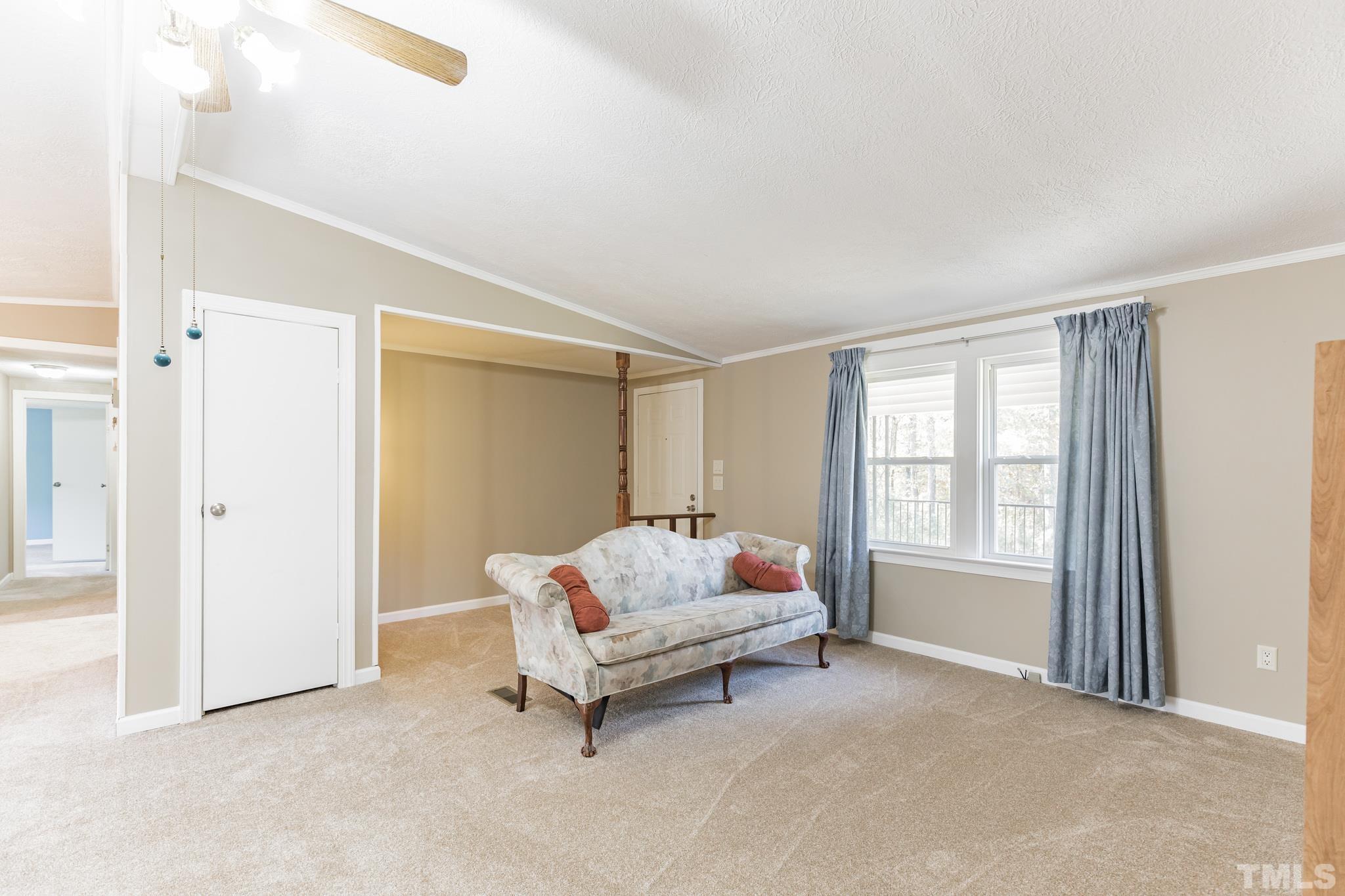 290 Thomas Cash Road Apex, NC 27523 - Photo 12 of 40 a spacious bedroom with a bed and a window
